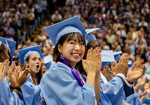 happy graduating carolina students clapping