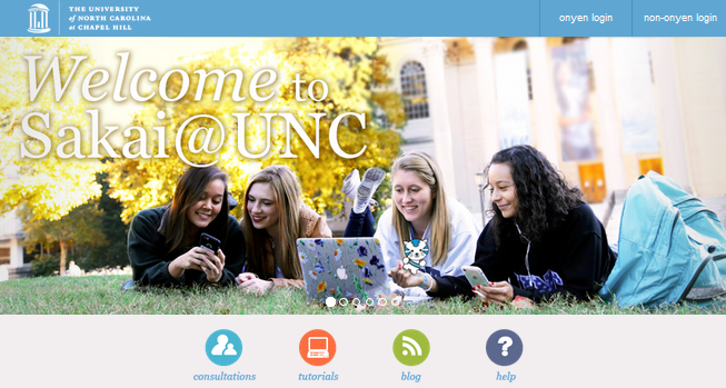 sakai photo of 4 carolina students with laptop on the quad