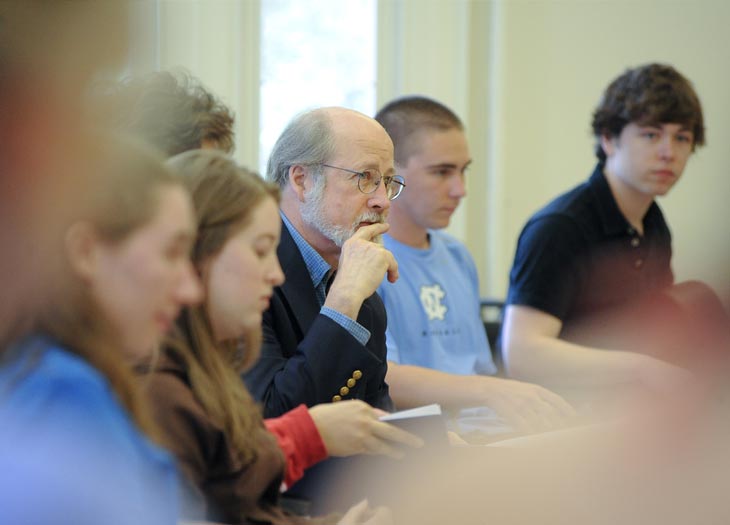 faculty sitting with carolina students