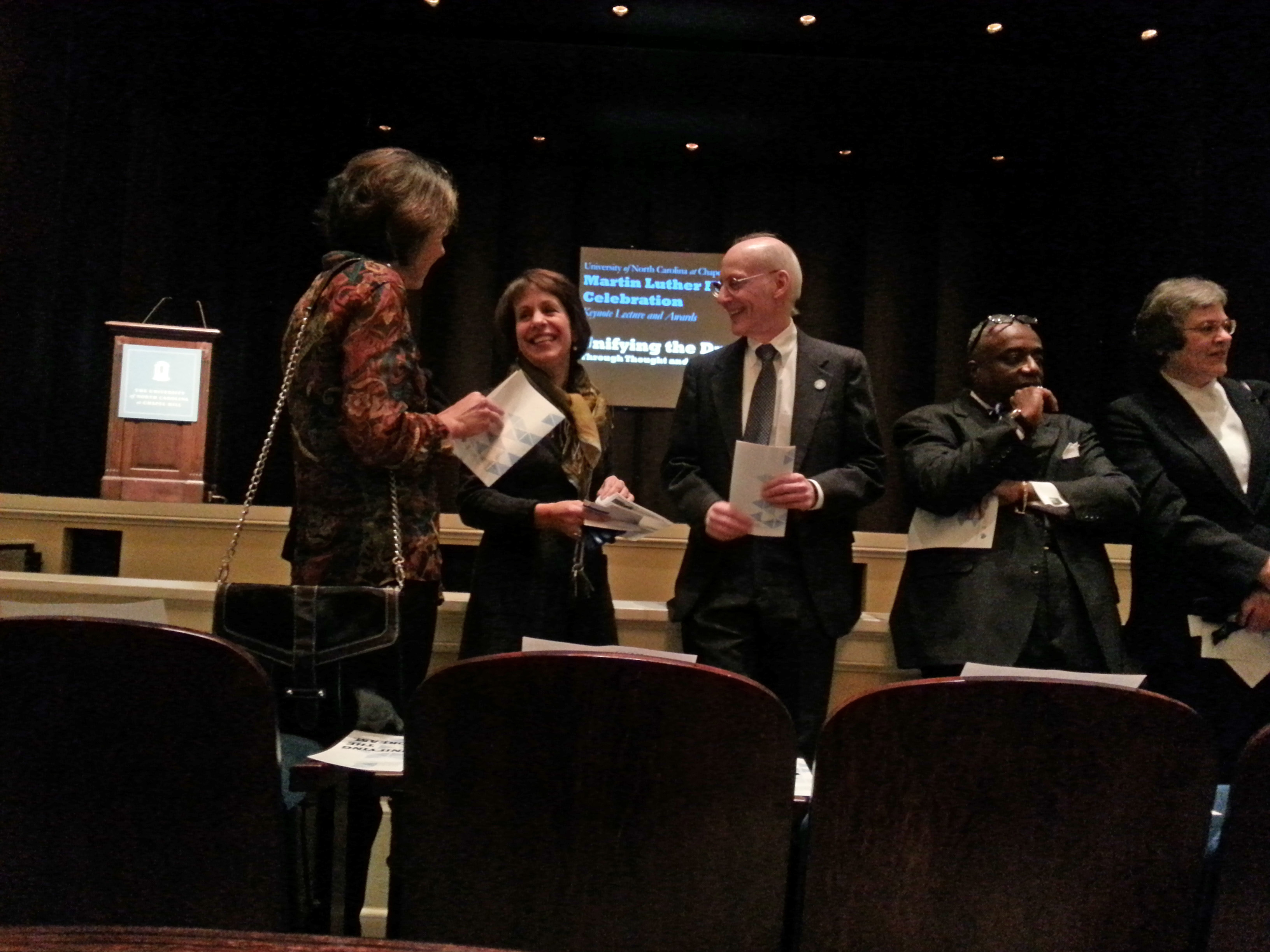 Photo of Chancellor Carol Folt with award recipients Victor Schoenbach and Eric Watson